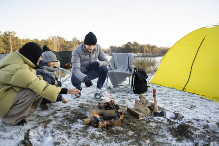 family having in winter camping